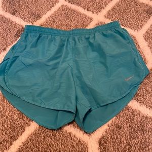 Blue Nike running shorts